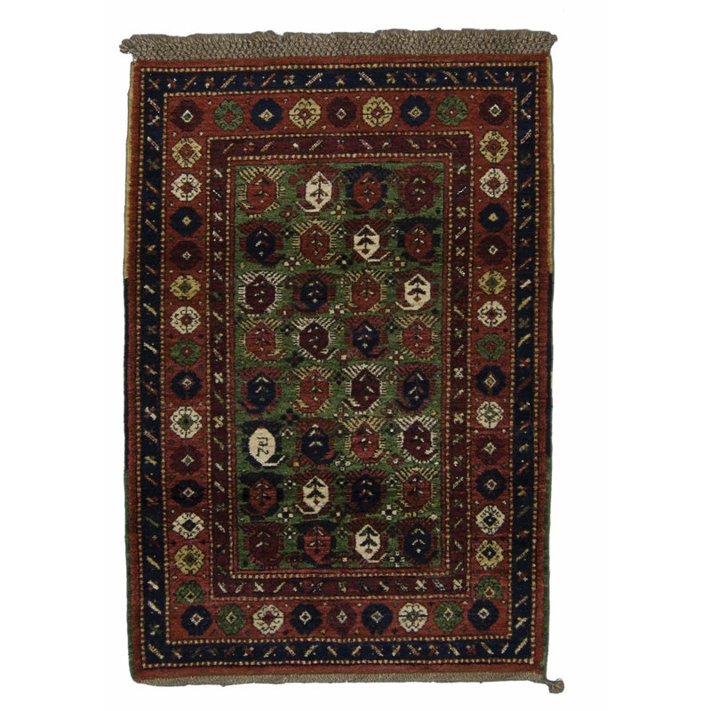 Seychour Wool Oriental Area Rug in Green/Red