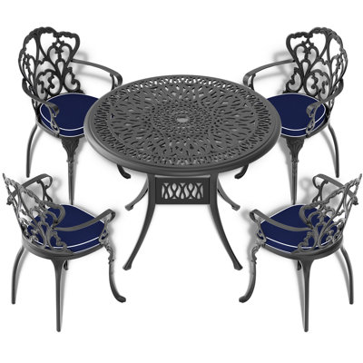 5-Piece Black Cast Aluminum Outdoor Dining Set, Patio Furniture With 35.43 In. Round Table And Random Color Cushions -  Bloomsbury Market, D177CF7E862E4F49ACD2BA6613F46850