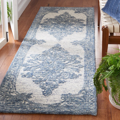 Tapis bleu / ivoire Metro 616