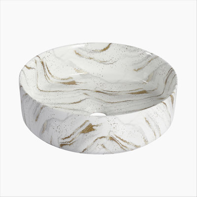Lavabo de salle de bain rond en céramique sur fond blanc avec lignes dorées