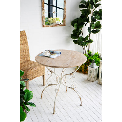 Round Wooden Table with Metal Scrollwork Legs