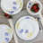 Gibson Ultra Violet Floral 12 Piece Tempered Opal Glass Dinnerware Set