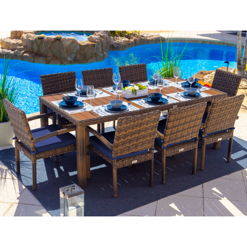 Tuscany Rectangular 8 - Person Rectangular Wicker Dining Set with Cushions, Sunbrella Canvas Navy