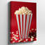 La toile crée une image en gros plan éclatante d'une boîte à popcorn rayée classique avec un popcorn blanc moelleux posé sur une toile-1274592091