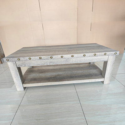 Rustic Wood Coffee Table With Rivets And Distressed Texture