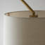 Thackinh Floor Lamp finished in Warm Brass and Cream