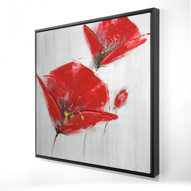 Trois fleurs rouges avec impression au centre doré sur toile