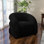 Fauteuil demi-tonneau pivotant rembourré Coyle