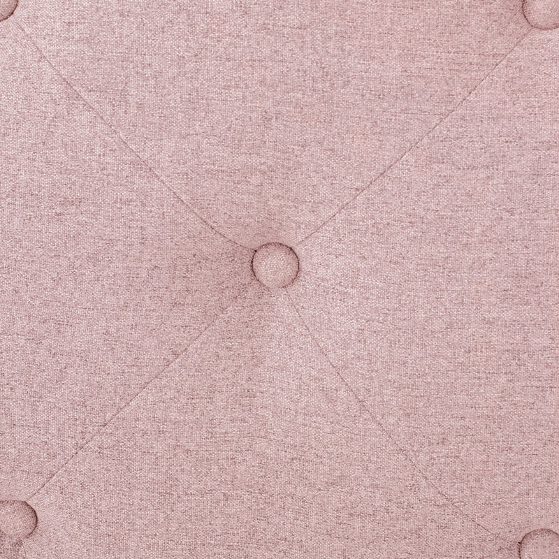 Tête de lit simple en tissu rosé avec coutures captivantes et garniture cloutée élégante aux accents contemporains