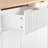 Fluted Kitchen Island With Storage, 55.5" Kitchen Island With Drop Leaf, Power Outlet, 4 Doors And 3 Drawers, Rolling Island Table With Wood-Grain Top, Curved Edge For Kitchen,Dining Room White