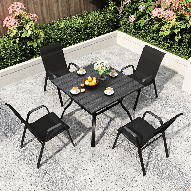 Ensemble de 4 chaises d'extérieur ergonomiques, en métal et en tissu d'aspect rouille, idéal pour les événements. Structure entièrement imperméable. Usage domestique et commercial.