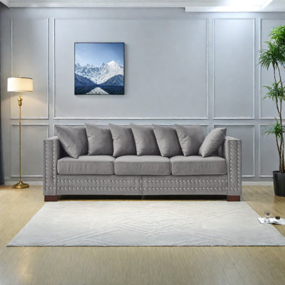 Canapé de salon moderne avec accoudoirs carrés décorés de clous argentés