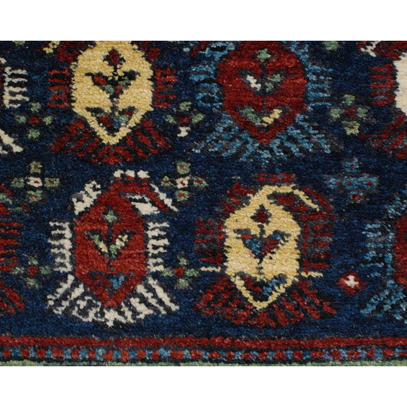 Seychour Wool Oriental Area Rug in Green/Red
