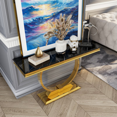 Console de luxe avec base en U en métal et plateau à texture brillante