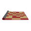 Tapis rouge/jaune à motifs-322382601