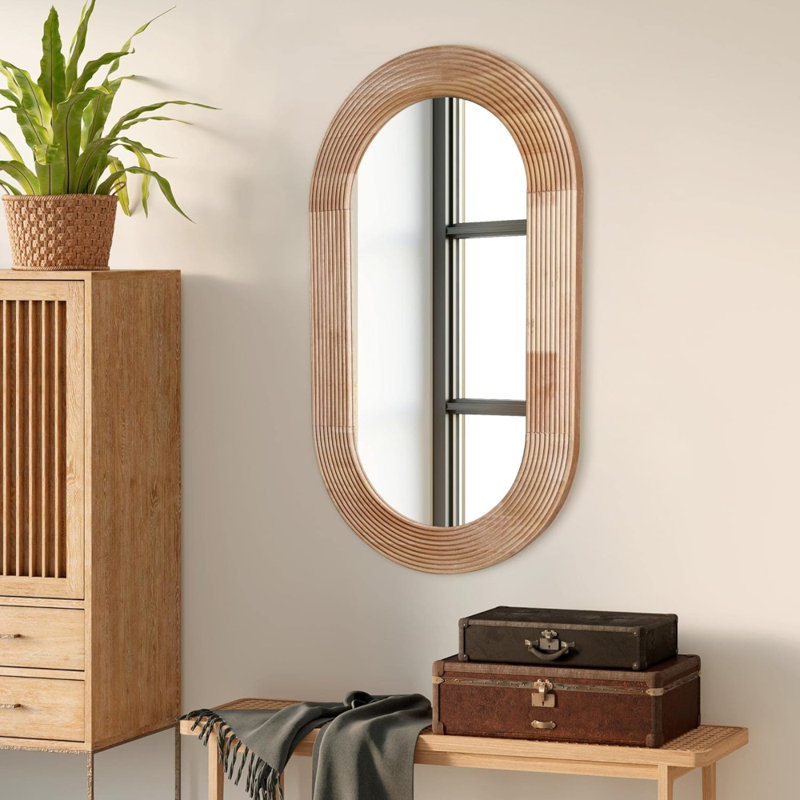 Miroir mural ovale en bois sculpté