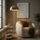 Lampe sur pied 2 lumières en laiton doré 58 po avec accents en rotin naturel Saluzzo