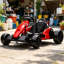Kart électrique rouge foncé avec construction robuste en PP et en métal, deux moteurs de 150 W
