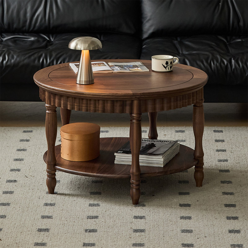 Table ronde à deux niveaux en noyer noir