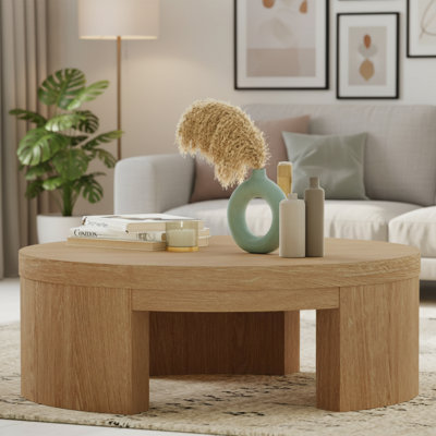 Modern Aesthetic Round Coffee Table With An Elegant Warm Honey-Colored Finish.