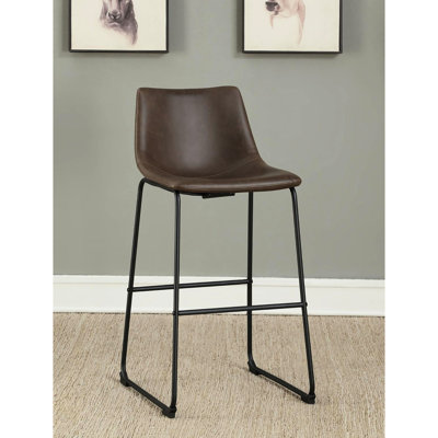 2 Brown & Black Bar Stools - Elegant Seating For Discussions. Two-Tone Upholstery. Supportive Back And Foot Support. Classic Industrial Design. Fits Different Discussion Areas. 39" H X 21" W 19" D.
