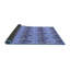 Tapis bleu en laine-399149752