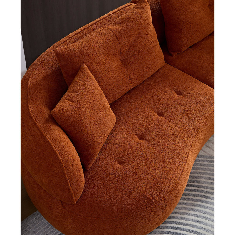 Élégant salon orange avec détails de sièges confortables modulaires et arrondis en tissu