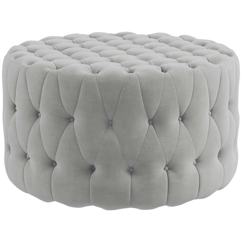 Repose-pieds capitonné à boutons avec revêtement en velours, parfait pour une utilisation polyvalente et confortable dans n'importe quelle pièce.