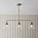 Anais 3lt Linear Pendant light finished in Ant. Brass