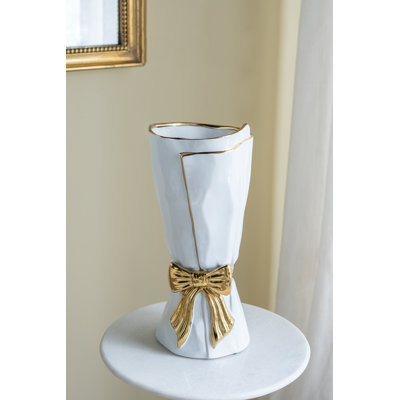 White Ceramic Vase With Ornate Gold Bow Design