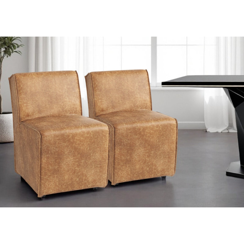 Ensemble de deux chaises d'appoint rembourrées en similicuir brun avec roulettes