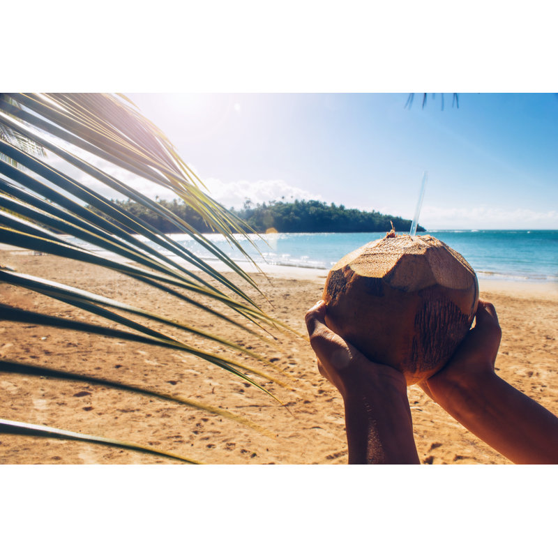 Woman Holding Coconut by Ukayacan - Wrapped Canvas Print, 81cm H x 122cm W
