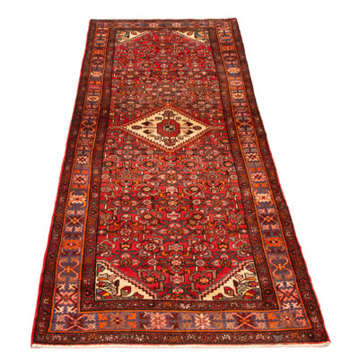 Splendid piece of work that is woven in Turkey with a re-interpretation of village Persian designs. The vintage and distressed look make this hand-knotted wool rug a natural standout.