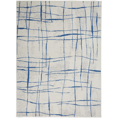 Tapis ivoire et bleu à motifs irréguliers