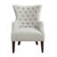 Fauteuil à oreilles capitonné