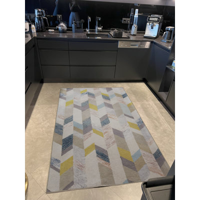 Tapis à motif géométrique beige à motif géométrique multicolore
