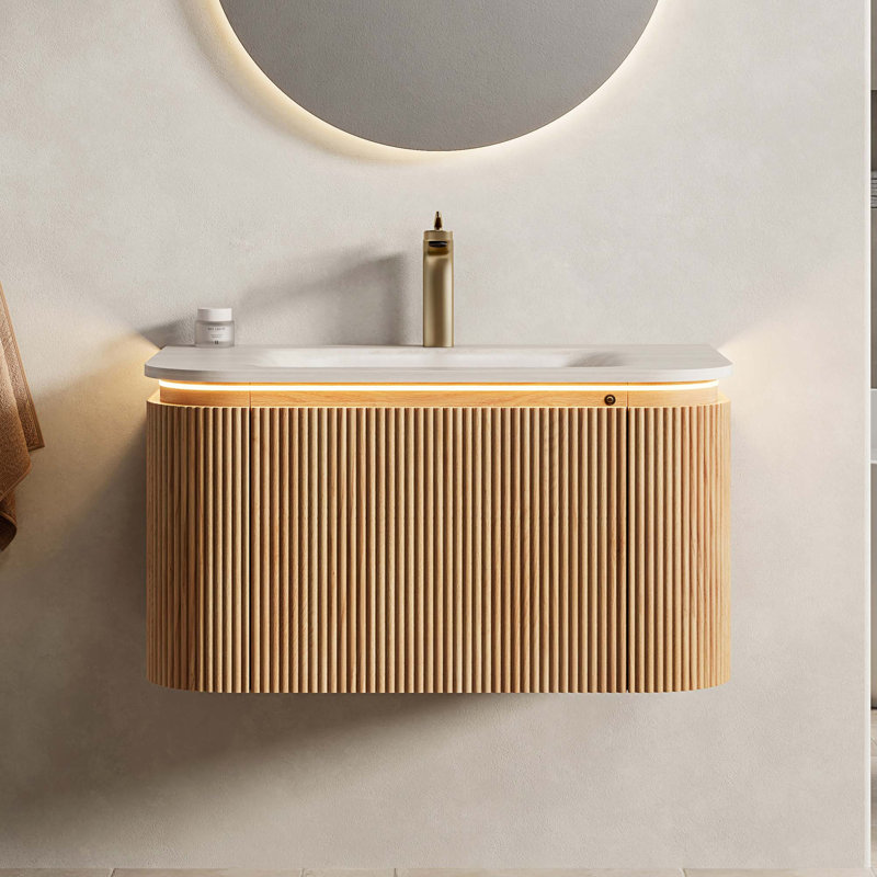 Meuble-lavabo suspendu avec lavabo intégré en pierre frittée et éclairage à détecteur de mouvement