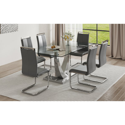 Ensemble de salle à manger moderne en verre: table à cadre argenté, chaises en cuir pu - style élégant pour les salles à manger contemporaines