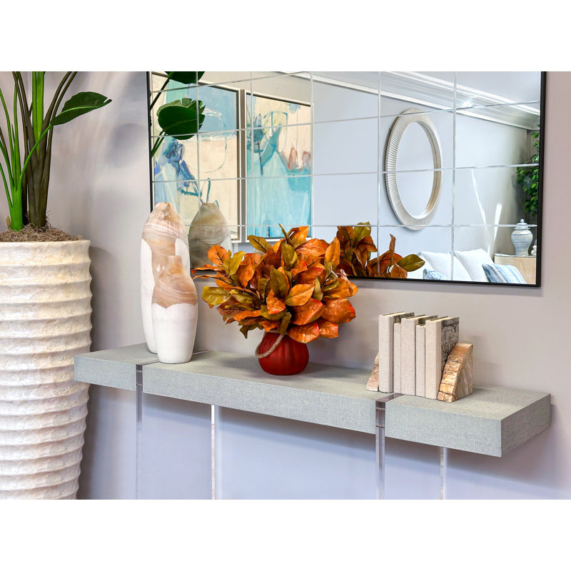 Fall Leaves Arranged in Glass Pumpkin Vase
