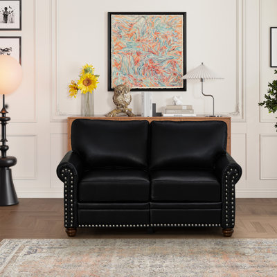 Salon en similicuir noir avec structure solide et confortable