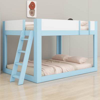 Bunk bed with reversible ladder and safety guardrails for low ceilings