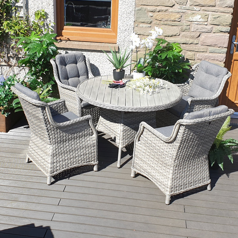 Spaldings 4 - Person Wicker Patio Dining Set with Round Table , Cushions Included