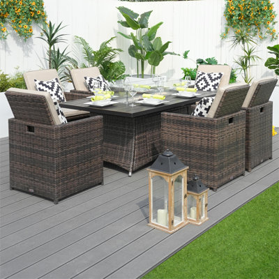 Takuya 6 - Person Wicker Patio Dining Set with Rectangular Table , Cushions Included