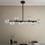 Lustre spoutnik noir 8 lumières avec abat-jour en verre transparent rayé pour la salle à manger