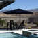 Gertha 9' x 12' Rectangular Double Top Cantilever Tilting Umbrella with Base and 360° Rotation