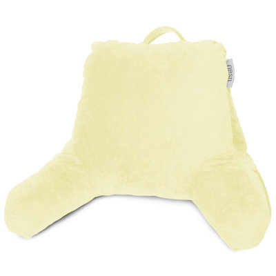 Reading back pillow in yellow velvet with a top carrying handle.