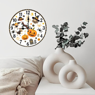 Halloween clock featuring cute ghosts