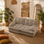 Canapé moderne deux places avec coussins à motifs ajourés, tissu chenille et design modulaire personnalisable pour salon et appartement