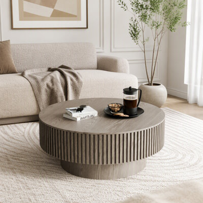 Table basse ronde avec rangement caché