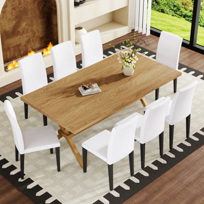 Ensemble de table et de chaises. Bureau de 71 po x 35,4 po en bois MDF avec table de salle à manger en X. Comprend 8 chaises de salle à manger en polyuréthane blanc avec des pieds en métal noir, ce qui en fait un choix idéal pour la maison.